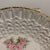 Delicate German pottery plates. Comes as a set of 10. Small roses circle the middle of the plate. Rims are decorated with...