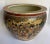 Here is a stunning Japanese Satsuma fishbowl vessel featuring hand-painted scenes of Geishas, gardens and birds. The...