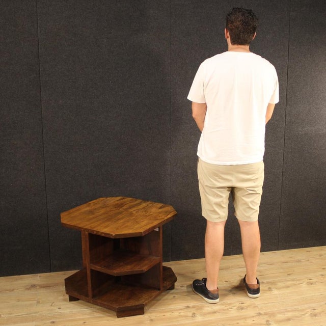 Italian design coffee table from the 60s / 70s. Particular line and construction furniture veneered in walnut. Coffee...