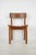 Vintage Mid Century Modern dining chair made of oak with a wide curved backrest and seat, and cylindrical shaped legs....