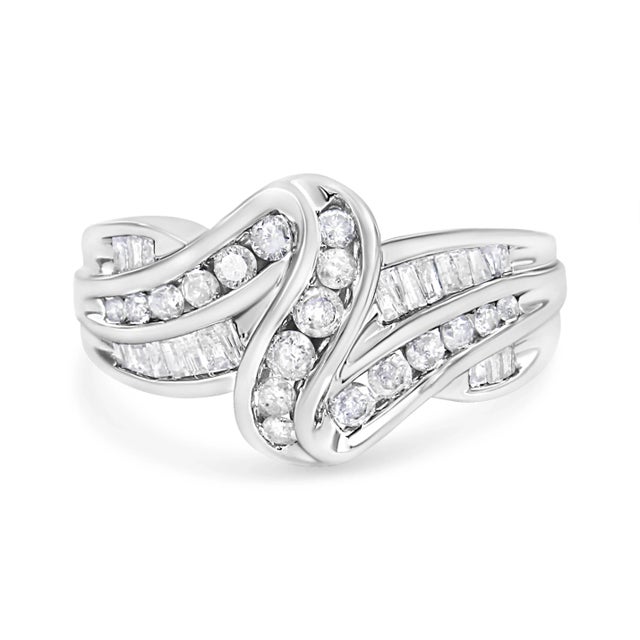 Natural diamonds and gleaming gold interlock each other to create this eye-catching bypass ring design. Created in shining...