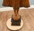 A striking large carved wooden standing Burmese Buddha figure, richly decorated and finished with a warm polychrome...