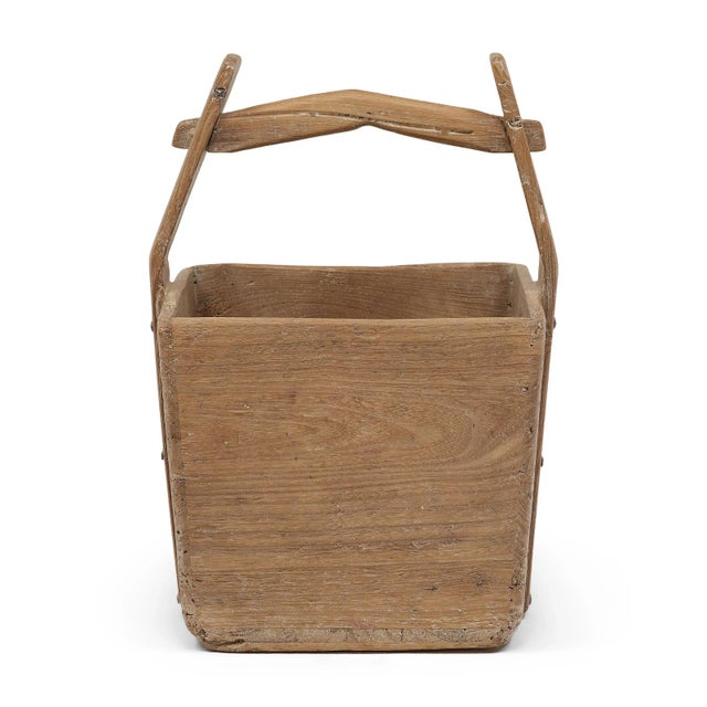 This hand-crafted wooden bucket was once used by farmers in Shanxi, China to transport their harvest of rice and grains...