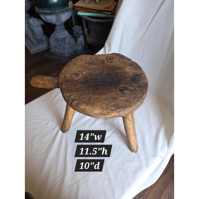 Primitive milking stool with three peg legs and a handkerchief area. Most likely mesquite wood and definitely from...