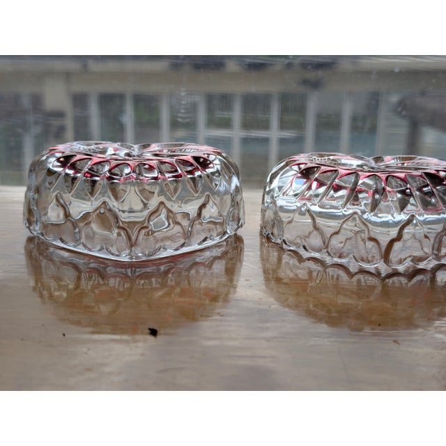 This is a matching pair of vintage heart-shaped trinket boxes from the celebrated "Byrdes" Ruby Collection by Hofbauer...