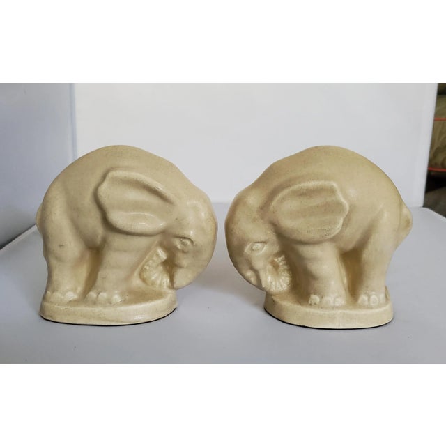 Great pair of art deco elephants done with a simple cream glaze. Can see an old stamp on bottom rim but can't id.