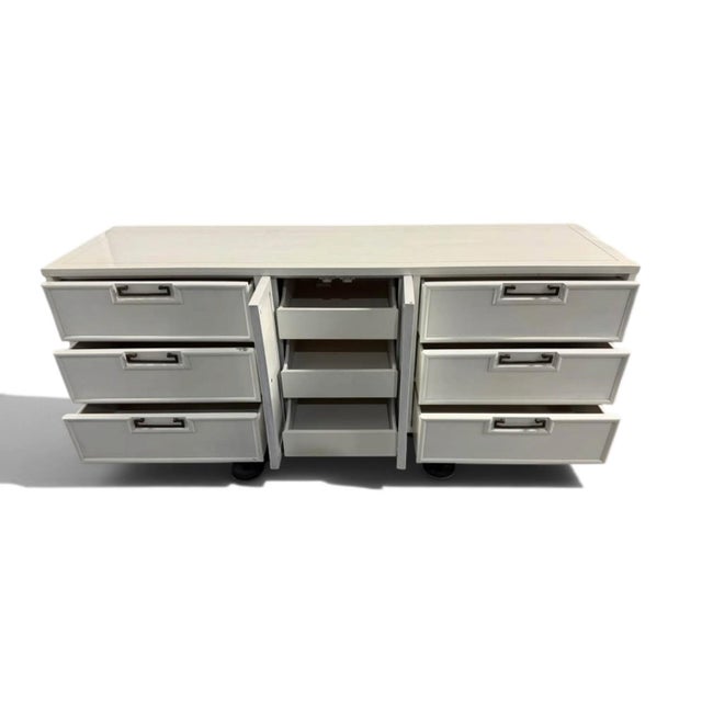 This sleek, sophisticated, mid-century modern solid Mahogany wood dresser by American of Martinsville, circa 1960s,...