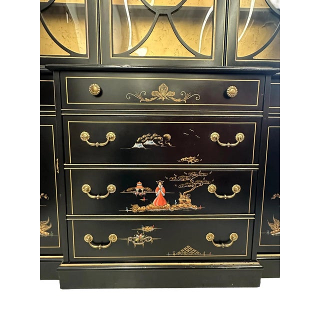 Elegant black lacquered display cabinet by Jasper Cabinet company. This impressive display cabinet features a lovely black...