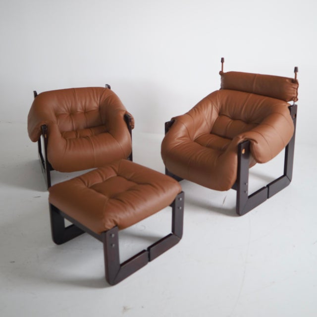 c. 1970s, Brazil - fully reupholstered in Maharam “Prone Ledge” leather. These are in excellent, restored condition but do...