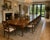 This outstanding antique Regency extending dining table, crafted from beautifully figured solid mahogany, comfortably...