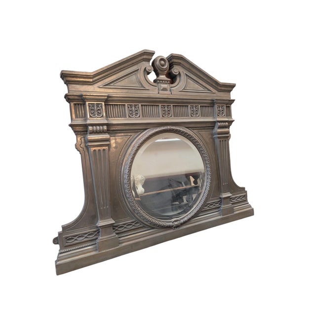 This substantial cast iron overmantel mirror is an antique reproduction of a late 19th-century English design, featuring...