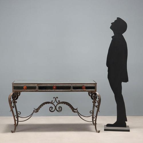 Iron and mirror console table. Top with beveled mirror, as are the three drawers in the band below the top. Four curved...
