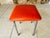 Mid century, skaï/ leatherette/vinyl and chrome stool circa 70s top of toll has an orange textured color skaï finish. legs...