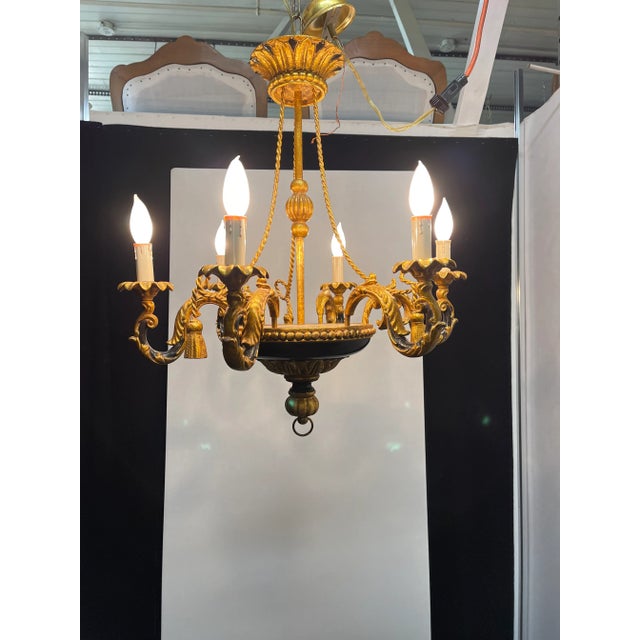 Charming Italian Venetian Black and Gold chandelier. Made in the 1960s in Italy. Chandelier is a gold tole and gold...