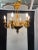Charming Italian Venetian Black and Gold chandelier. Made in the 1960s in Italy. Chandelier is a gold tole and gold...