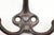 Vintage cast iron triple arm acorn wall hook with a black finish and raised heart in the center. The original mounting...