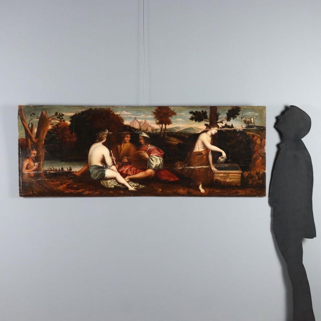 Oil on panel. The painting echoes the composition of Titian's masterpiece (dated 1510, currently in the Louvre), but...
