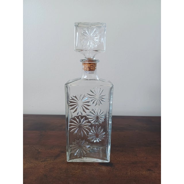 Super cool glass decanter from the 50s-60s era. Its front, back and top have a neat star like design. Similar to ones used...