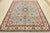 This traditional tribal geometric Caucasian Kazak rug is hand-knotted with an all-wool pile on a cotton foundation. This...