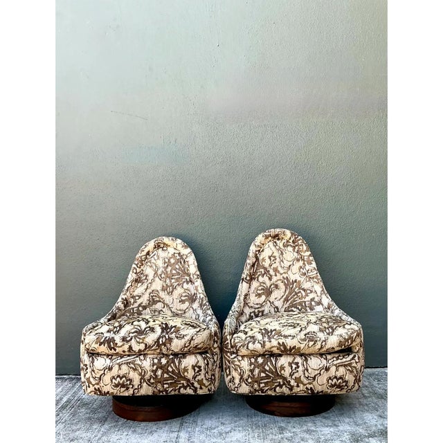 This pair of vintage Milo Baughman for Thayer Coggin petite swivel chairs exemplifies the sculptural, organic silhouette...