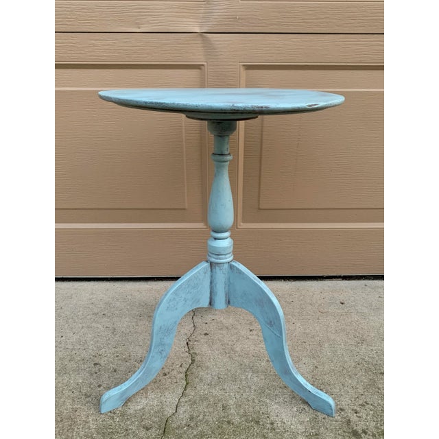 A handsome French Country drinks table crafted in walnut, painted a soft antique blue. The elegant turned pedestal and...