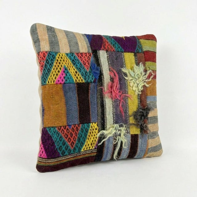 This beautiful 20'' X 20'' pillow cover was made from an authentic Turkish Kilim. Bright colors of wool adorn the front of...