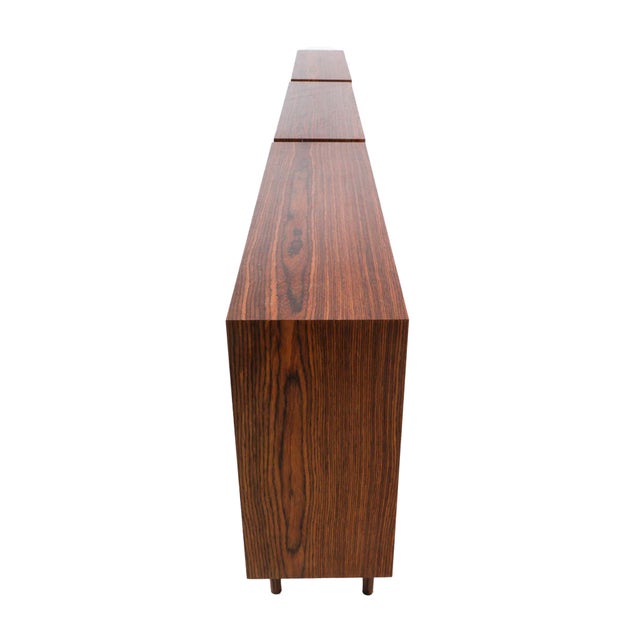 A set of three Danish. Modern rosewood bookcases, in the minimalist and well-crafted manner of Brouer Møbelfabrik. Simple,...