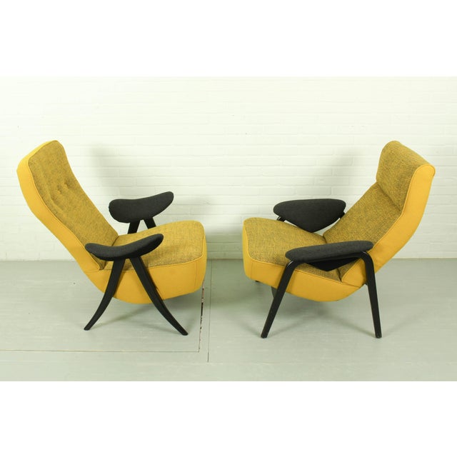 A spectacular and highly collectible pair of mid-century modern lounge chairs designed by the pioneer of Dutch design,...