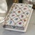 This vintage heirloom trinket box is a beautifully hand-painted porcelain piece in the shape of a book, adorned with a...