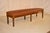 19th century English oak bench with newly upholstered leather top with nail head trim. The frame of the bench is lovely...