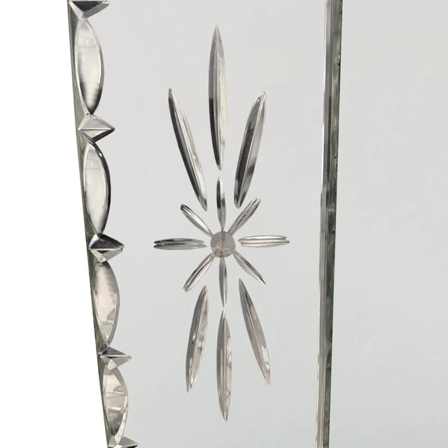 This is an elegant large mirror with a simple design in the Venetian style. Decorated with stars and a bevelled border....