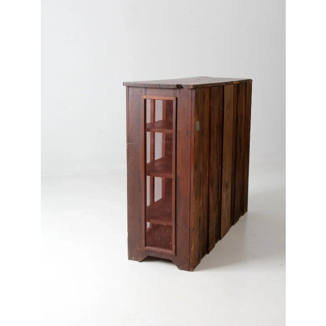 This is a stunning antique pie safe cabinet. The wooden cupboard features mesh screen panels on the sides and doors....
