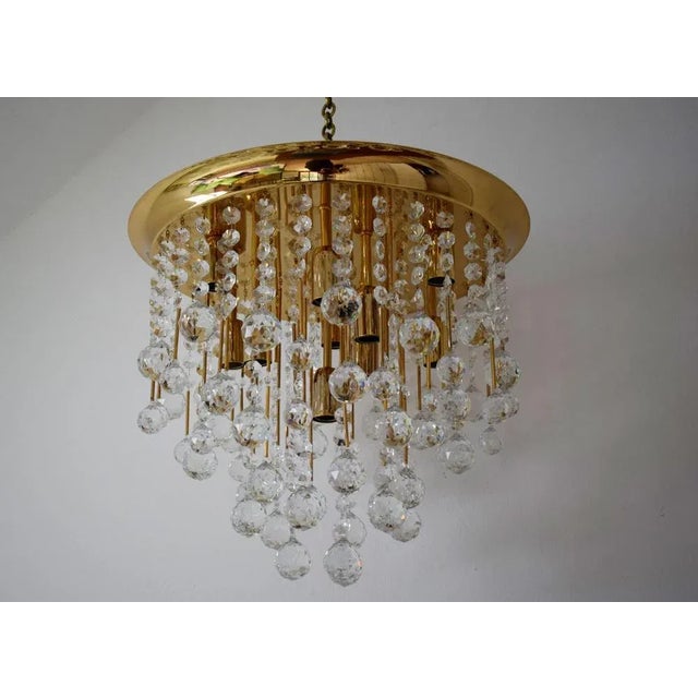 Great ceiling lamp with many large Svarovski crystal ball. Gilded brass. 10 versions E14 Up to 250V (Europe/UK...