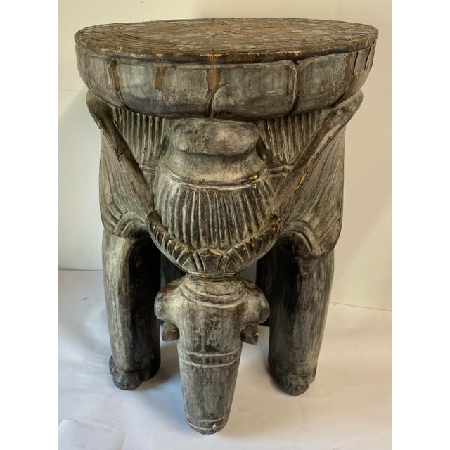 Vintage hand carved wooden elephant shaped stool.