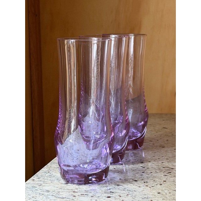 Add a touch of mid-century magic to your bar cart with this striking set of six vintage Alexandrite (neodymium) glass...