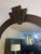 Large scale tall floor mirror in the style of Karl Springer having art deco dome arch. Patina is a metallic brown. Overall...