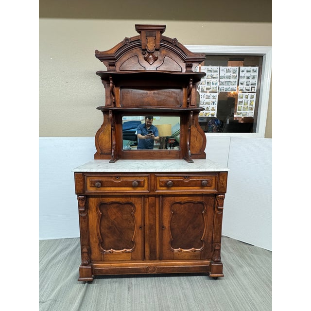 Design Plus Gallery presents a Dark Walnut Wood Sideboard from the Renaissance Revival Era. This piece is a fine example...