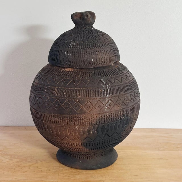 Antique Hand Thrown Kalinga Pottery Storage Jars and Vessel, a Set of Three Ceramic vessels of Kalinga are divided into...