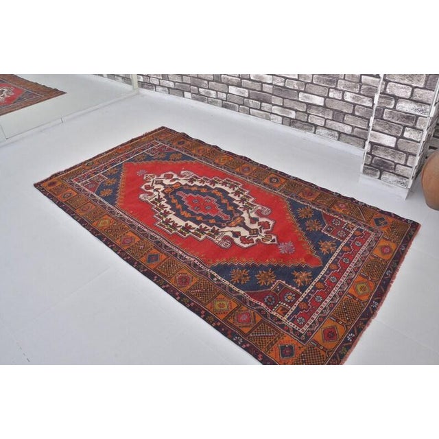 Vintage Anatolian Wool Area Rug, Bold Red Field With Navy Blue Geometric Medallion For Sale - Image 4 of 10