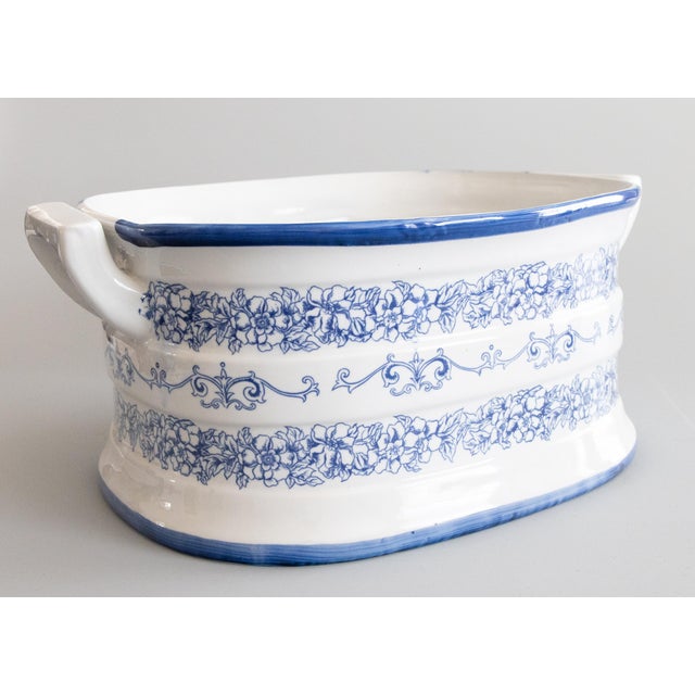 A vintage Mid-Century Italian blue and white white porcelain ironstone foot bath basin / jardiniere / planter crafted in...