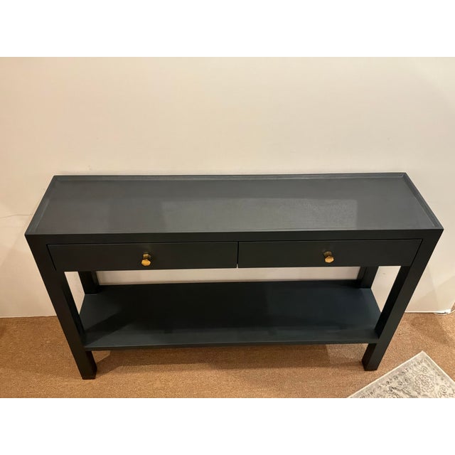 Stylish Made Goods Co Jarin Dark Navy Console. Two drawers, dark navy finish. Gold hardware. Original Retail $3080....