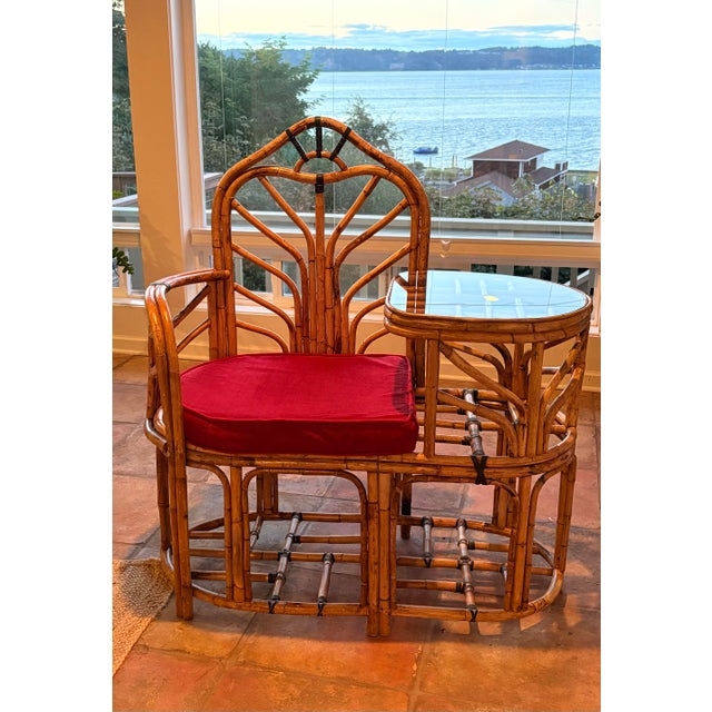 This piece of furniture is a vintage rattan telephone bench also known as a gossip bench or gossip chair. Popularized in...