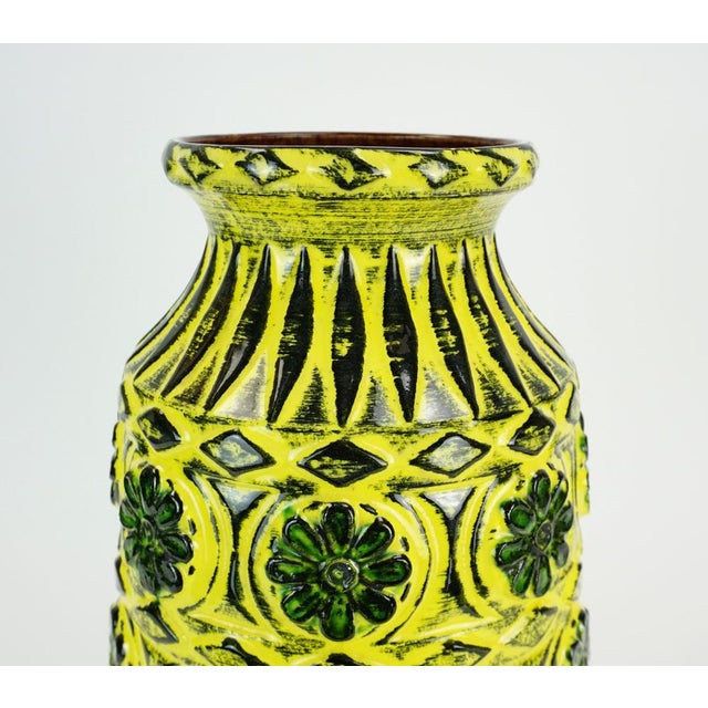 Vintage West German ceramic vase, manufactured by Bay Keramik West-Germany in the 1960s. Relief surface with a floral...