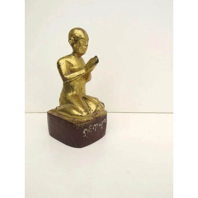 Very nice carved wood gilt finish figure of a monk. Measures 7 1/4" tall. Some loss to finish. B.2608