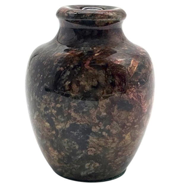 Carved from solid marble, this small yet weighty vase brings together the permanence of stone and the warmth of autumn...