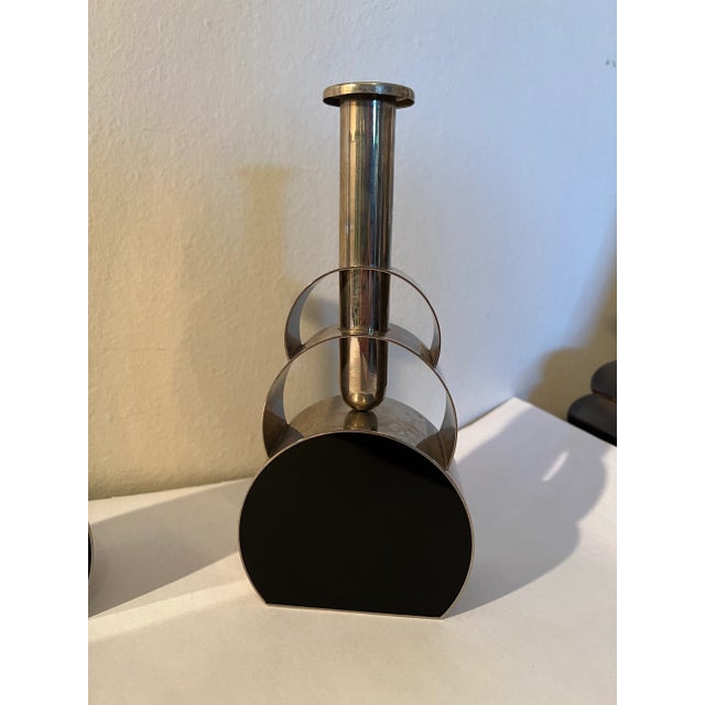 A very unique pair of Mid-Century Modern or Art Deco style chrome & black enameled candlesticks / bud vases. Shockingly...