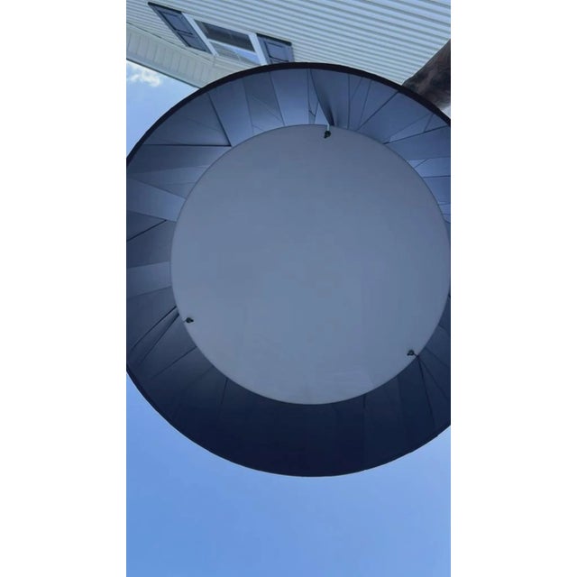 Elevate your space with this bold, contemporary hardwired drum pendant light. Featuring a dramatic, wide drum shade with...