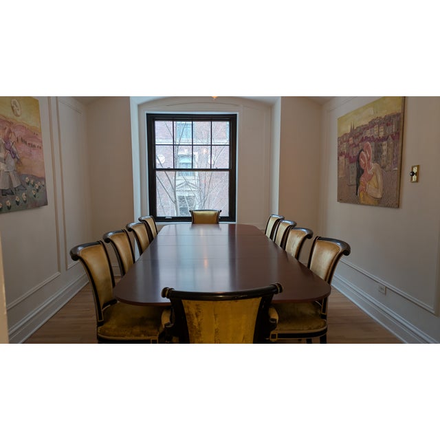 on offer is a solid mahogany dining table with 10 gold crushed velvet chairs. Produced by Baker Furniture in North...