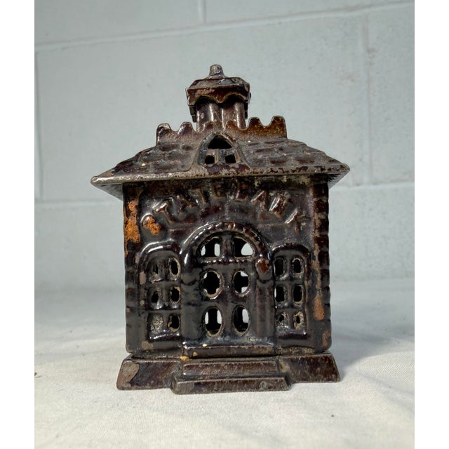 Up for sale is a rare single peak miniature antique cast iron still bank made by the U.S. company Kenton Toys. This...