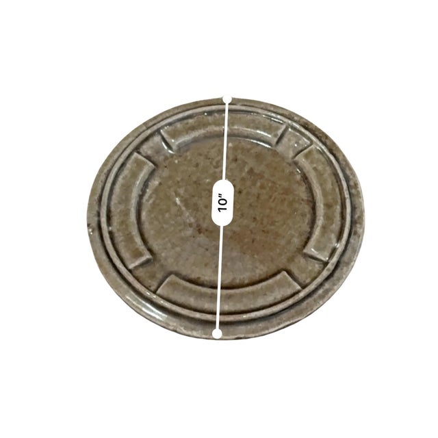 This sculptural mid-century studio pottery piece features a wide, low-profile form with four integrated rests along the...